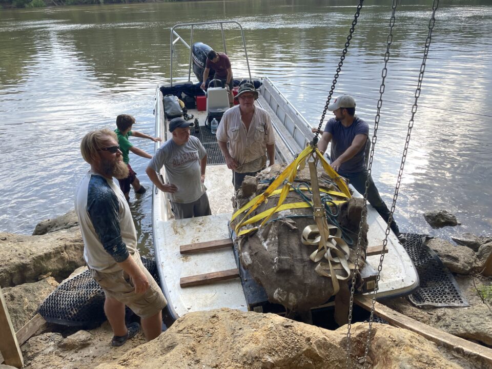 Members of the extraction team preparing to transport the Ueloca fossil byboat. Left to right: Josh Goff, Miller Nama, Jun Ebersole, Corey Harper, Charles Nichols, Andrew Gentry. Photo by Erik Kizee.