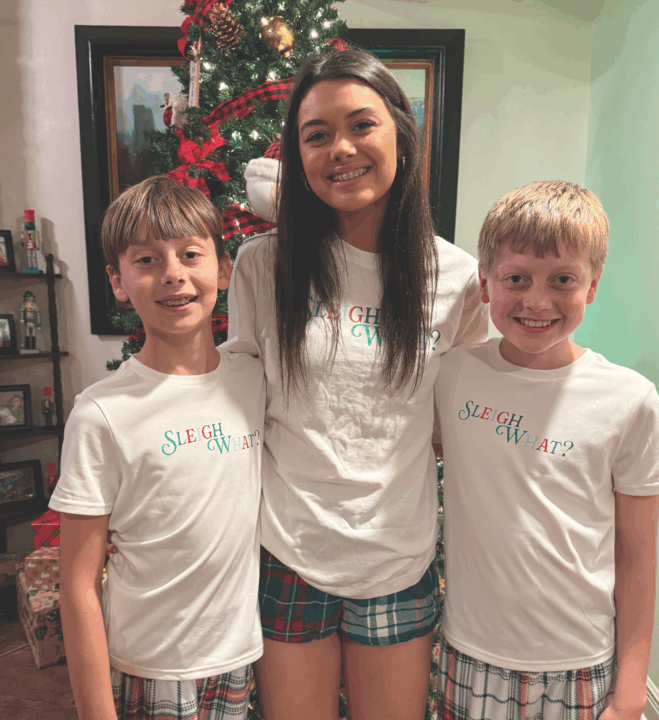 Amy's kids by the Christmas tree