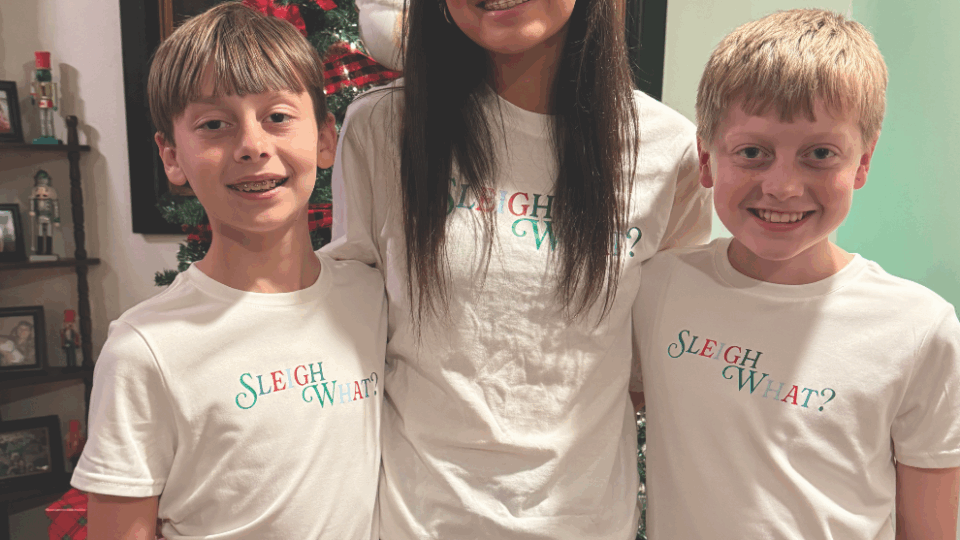 Amy's kids by the Christmas tree